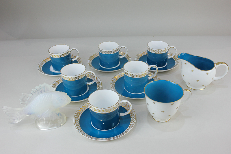 A set of six modern Susie Cooper porcelain coffee cans and saucers, and a similar teacup and jug,