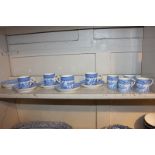 A set of four Royal Worcester porcelain coffee cups and saucers in blue and white Chinese design,