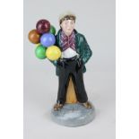 A Royal Doulton porcelain figure, Balloon Boy (HN2934), 20cm high