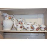 A Hammersley & Co porcelain four-piece tea set with floral design, together with a similar wash jug