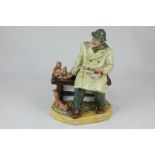 A Royal Doulton porcelain figure, Lunchtime (HN2485) of a seated man feeding red squirrels, 20cm