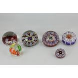 A Scottish Strathearn millefiori paperweight, together with three other millefiori paperweights,