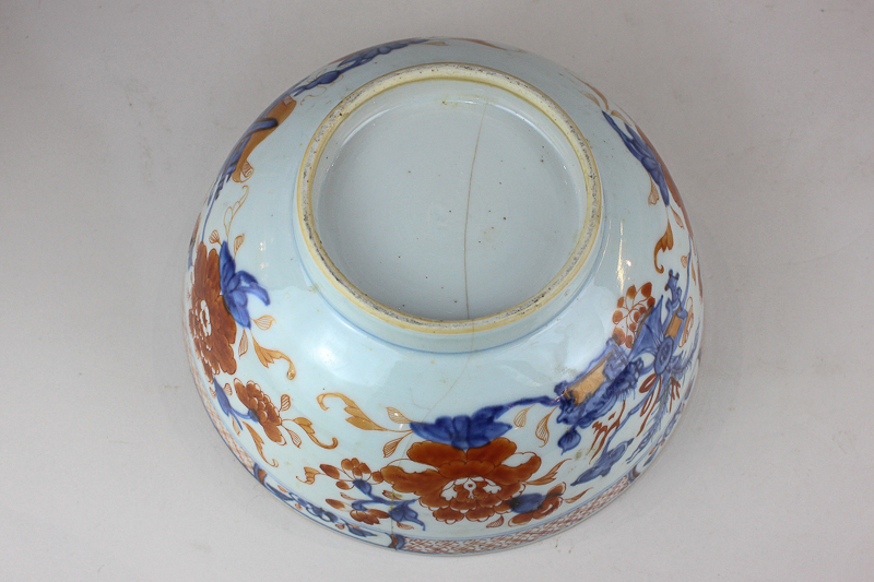 A Chinese porcelain bowl decorated with blossom and flowers in Imari palette (a/f - hairline), 23cm - Image 2 of 2