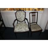 An Edwardian mahogany shield back salon chair with upholstered back and drop in seat, on tapered