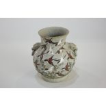 A small Japanese urn shaped vase, the body decorated with bird of prey in a flock of flying birds