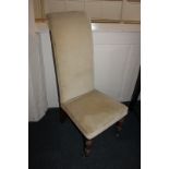 A prie-dieu chair with corduroy upholstered back and seat, on acanthus carved and turned front