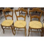 French 19th cent. Beech rush seated dining chairs, shaped bar back on serpentine supports, 1 a/f.