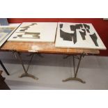 Ellis Family Archive: Small trestle table, iron legs, wooden top. 48ins. 30½ins.