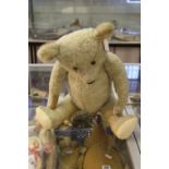 Toys: Continental teddy bear, pale brown plush glass eyes, repairs to soles of feet and one paw,