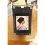 Glassware: Freestanding photo frame with ridge decoration black leather backing and stand.