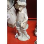 20th cent. Ceramics: Lladro girl with lamb 4505 plus a boy in waders. (2)