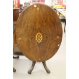19th cent. Walnut oval tilt top table, satin and fruit wood inlay, carved 5 column support with
