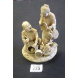 Oriental: 19th cent. Ivory Japanese figure group depicting fisherman and the tools of his trade.