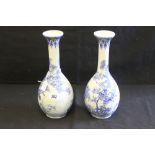 19th cent. Japanese blue & white elongated bulbous vases decorated with floral and tree motifs - a