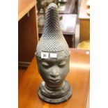 20th cent. African Art: Reproduction Benin head on circular base. 18ins. including base.