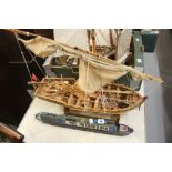 Models: Scratch built models of a canal barge 21ins. and a Royal Navy rowing boat with mounted bow
