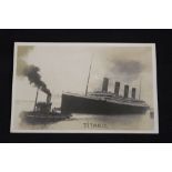 R.M.S. TITANIC: Unusual real photo pre-sinking postcard in sepia of Titanic leaving Southampton.