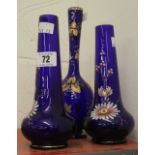 Glassware: Cobalt blue bud vases decorated with enamel painted floral patterns, a pair plus 1