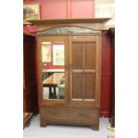 Early 20th cent. Arts and Crafts oak wardrobe, mirrored and planked doors, embellished with copper