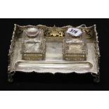 Hallmarked Silver: Desk stand comprising 2 glass inkwells with silver collars and lids and