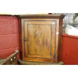 Late 18th cent. figured mahogany dwarf hanging wall cupboards with shaped serpentine shelf.