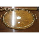 20th cent. Honey oak 2 handled tray with single bar gallery 23ins x 15ins and a tribal carved