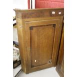 19th cent. Oak corner cupboard, shaped shelves, wall mounted.