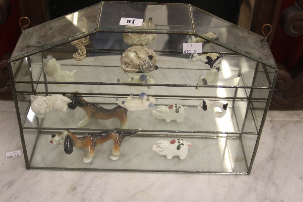 20th cent. Wade and other animals. 15ins x 11ins. (Display case not included).