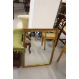 Early 20th cent. Gilt framed gesso mirror 24ins x 33ins.