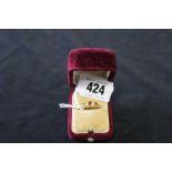 Hallmarked Gold: 18ct. Boat shaped ring with 3 rubies & 2 diamonds set in 3.3grams inclusive.