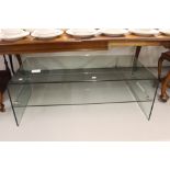 20th cent. Glass coffee table with shelf beneath. 3ft. 10ins x 1ft. 10ins x 1ft. 4ins.