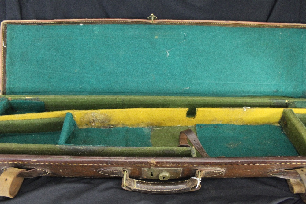 Shooting: Early 20th cent. leather single gun case 32ins x 8ins (for 28ins D/barrels), green baize