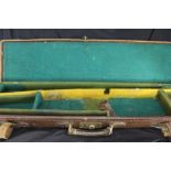 Shooting: Early 20th cent. leather single gun case 32ins x 8ins (for 28ins D/barrels), green baize