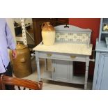 Edwardian marble topped washstand, tiled back, single drawer with central cupboard below, turned