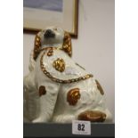 19th/20th cent. Ceramics: Staffordshire comfort dogs, King Charles dog, gilt ears, chain and collar,