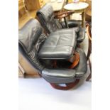 20th cent. Black leather/PVC reclining armchair with footstool.