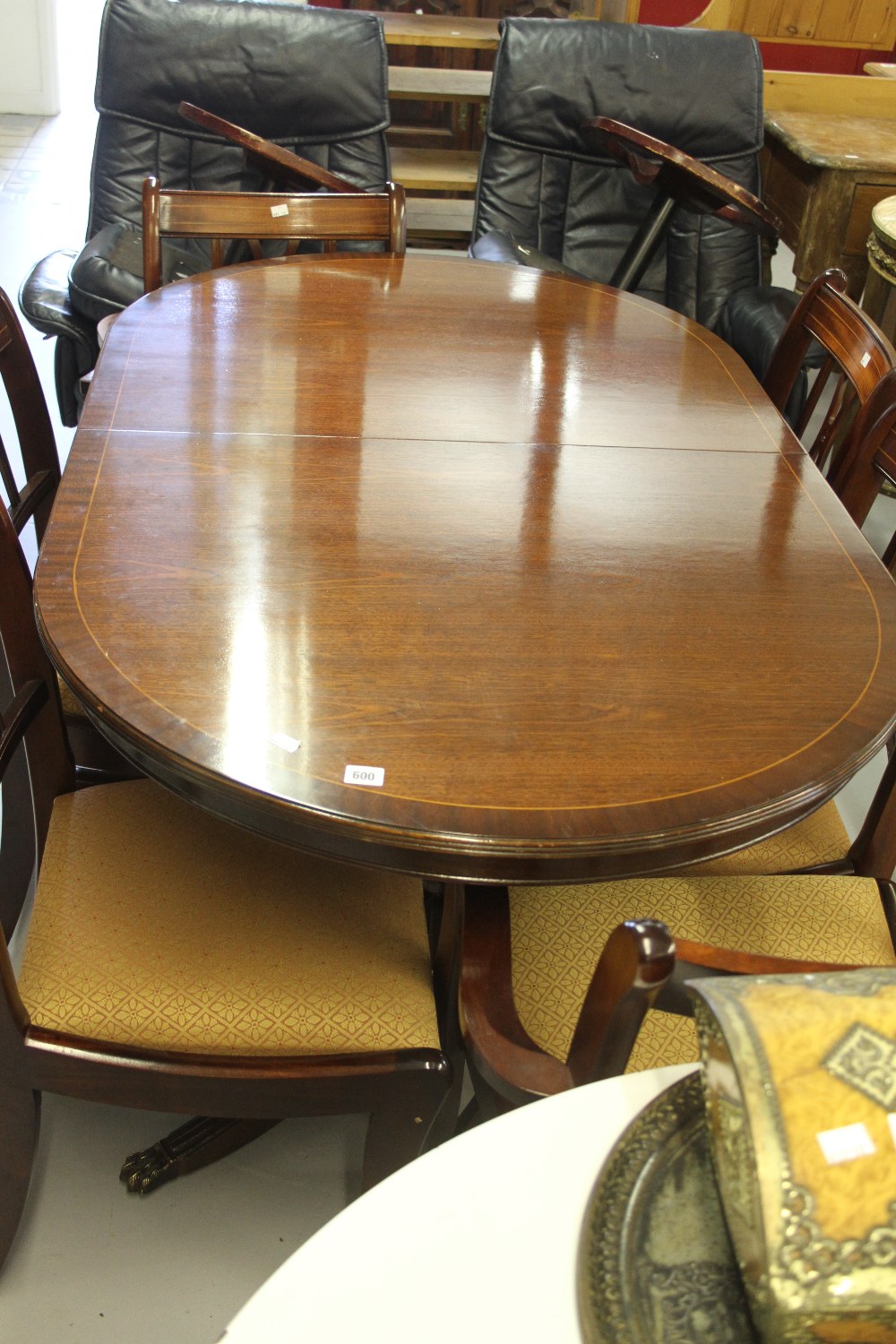 20th cent. Mahogany dining room extending table with 6 drop in seated chairs including 2 carvers.