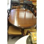 20th cent. Mahogany dining room extending table with 6 drop in seated chairs including 2 carvers.