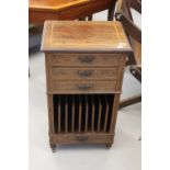 Late 19th cent. Mahogany inlaid music cabinet, 3 drawers above a rack. Width 16ins.