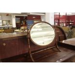 Early 20th cent. Skeleton bevel edge mirror with fruitwood stringing on banded supports.