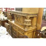 20th cent. Honey oak court cupboard in a Jacobean style 5ft x 4ft 8ins x 1ft 8ins.