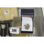 Designer Jewellery: Opal set cluster ring,18ct. Stamped and tested .