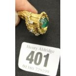 Diamond & Emerald Jewellery: Designer ring set with cabochon cut emerald surrounded by five small