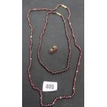 Garnet Jewellery: Necklace x 2, round beads 17ins and 28ins plus a pair of pierced garnet earrings