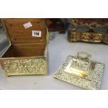 Brassware: Desk inkwell with glass liner plus a treen lined brass box, floral design.