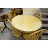 20th cent. Circular beech table & 4 chairs.