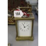 Late 19th cent. Brass carriage clock with enamel face. 5ins.