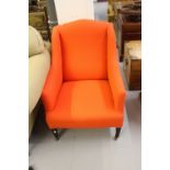 20th cent. Upholstered armchair with orange upholstery.