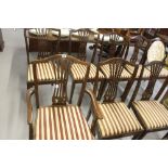 20th cent. Mahogany dining room chairs, 7 & 1 carver. Flocked upholstered with drop in seats. (8).