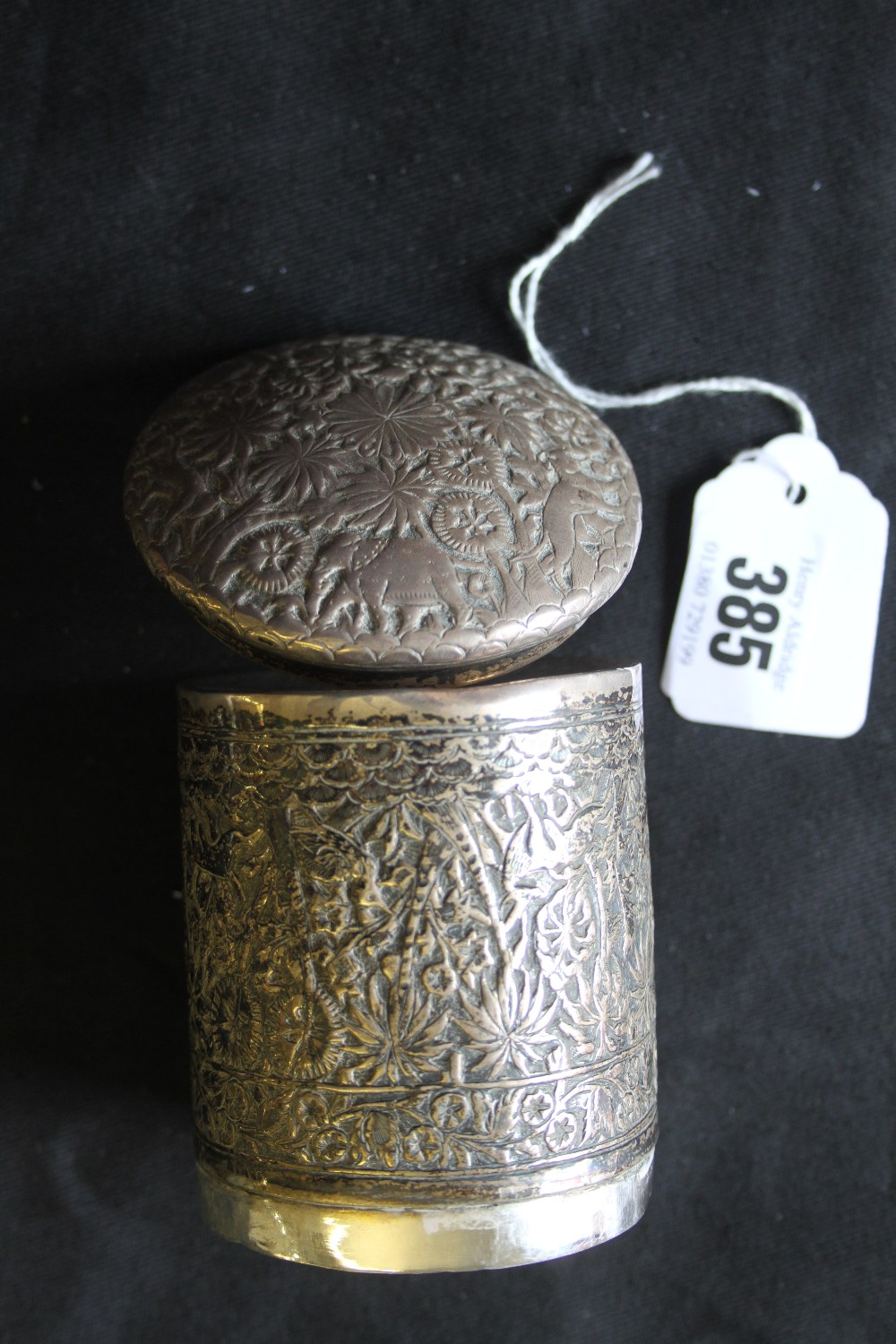 19th cent. White metal Indo Persian pot & cover, embossed jungle and animals. 3½ins high.